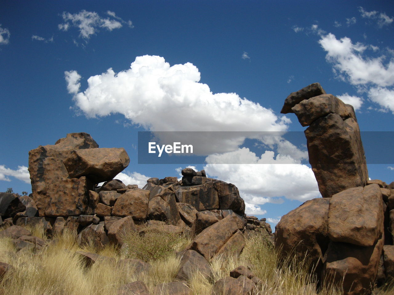 PANORAMIC VIEW OF ROCK FORMATIONS ON LANDSCAPE AGAINST SKY