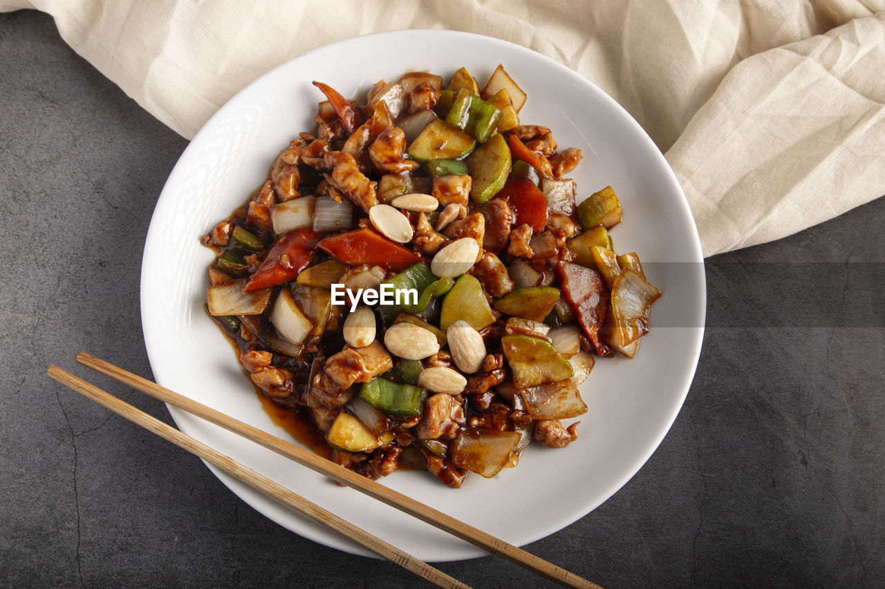 Oriental chicken with almonds. typical chinese food