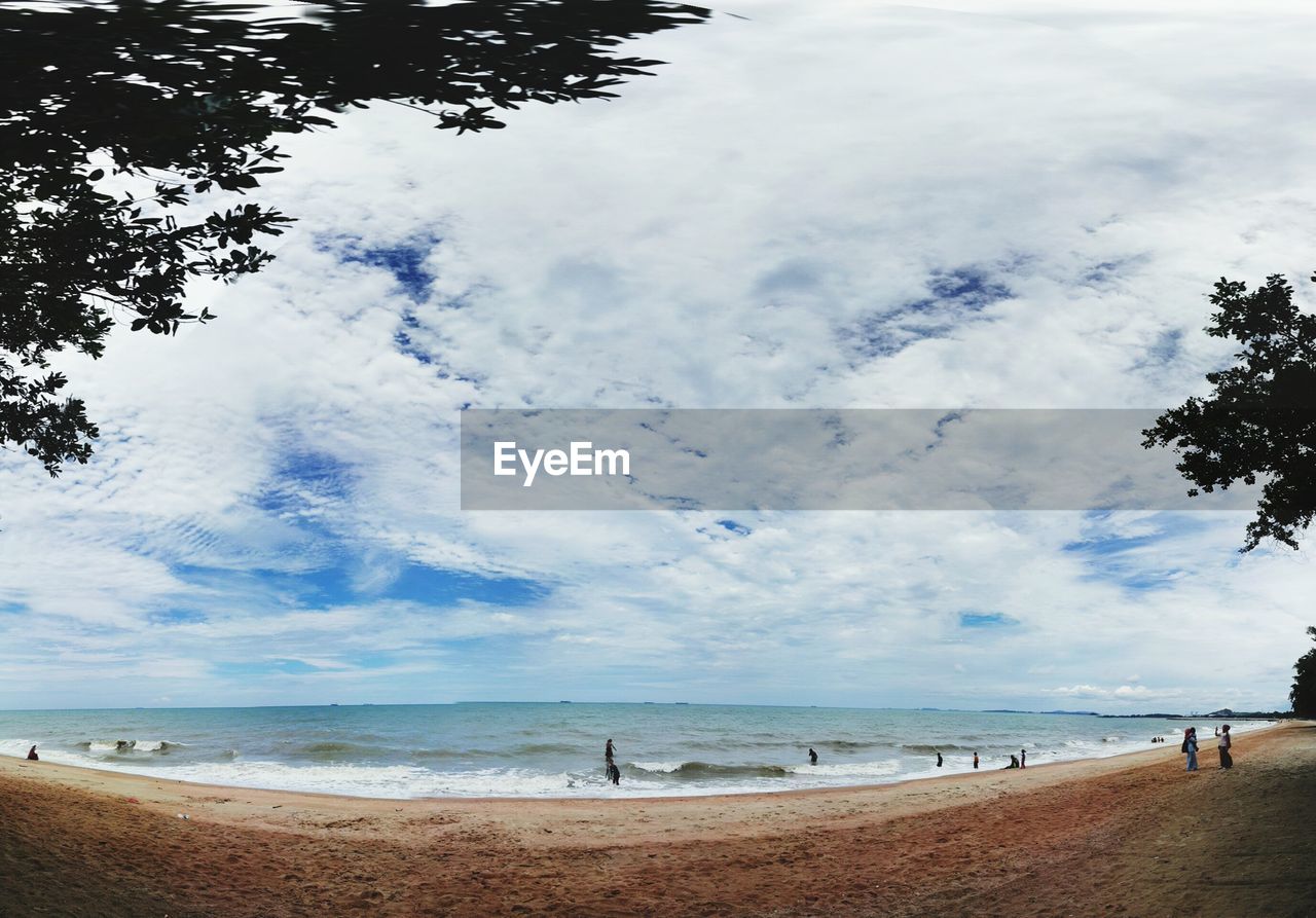 PANORAMIC VIEW OF BEACH AGAINST SKY