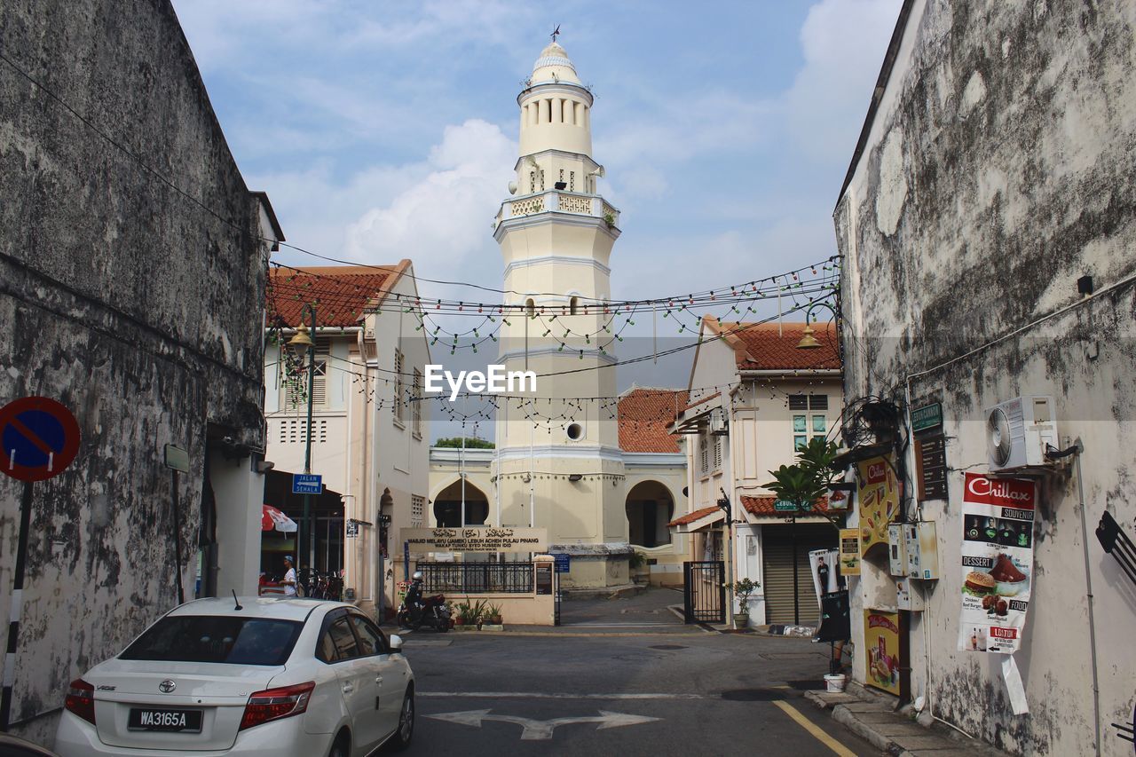 VIEW OF BUILDINGS ALONG ROAD