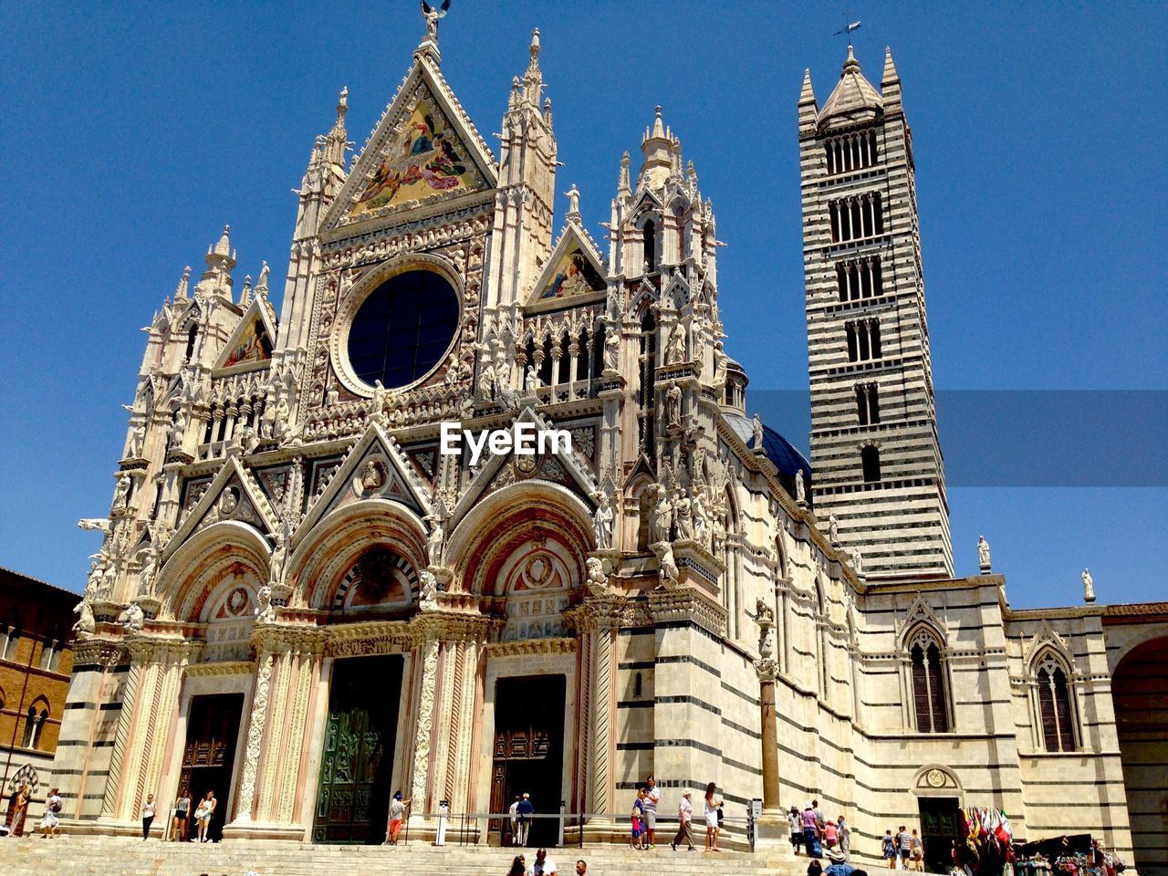 LOW ANGLE VIEW OF CATHEDRAL AGAINST BUILDINGS