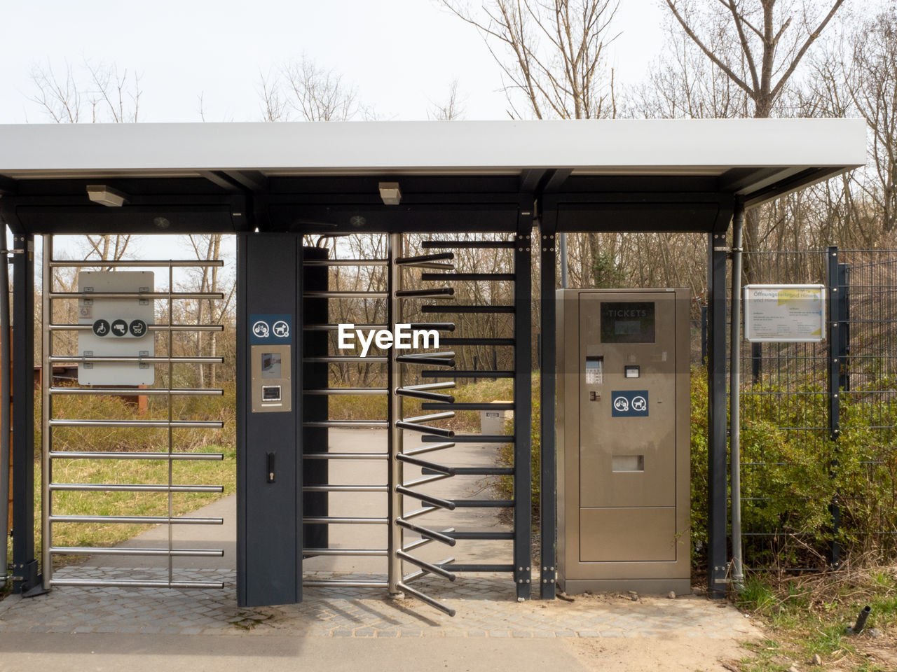 architecture, entrance, built structure, door, outdoor structure, no people, building exterior, tree, day, nature, shed, security, building, plant, gate, protection, outdoors, closed, communication