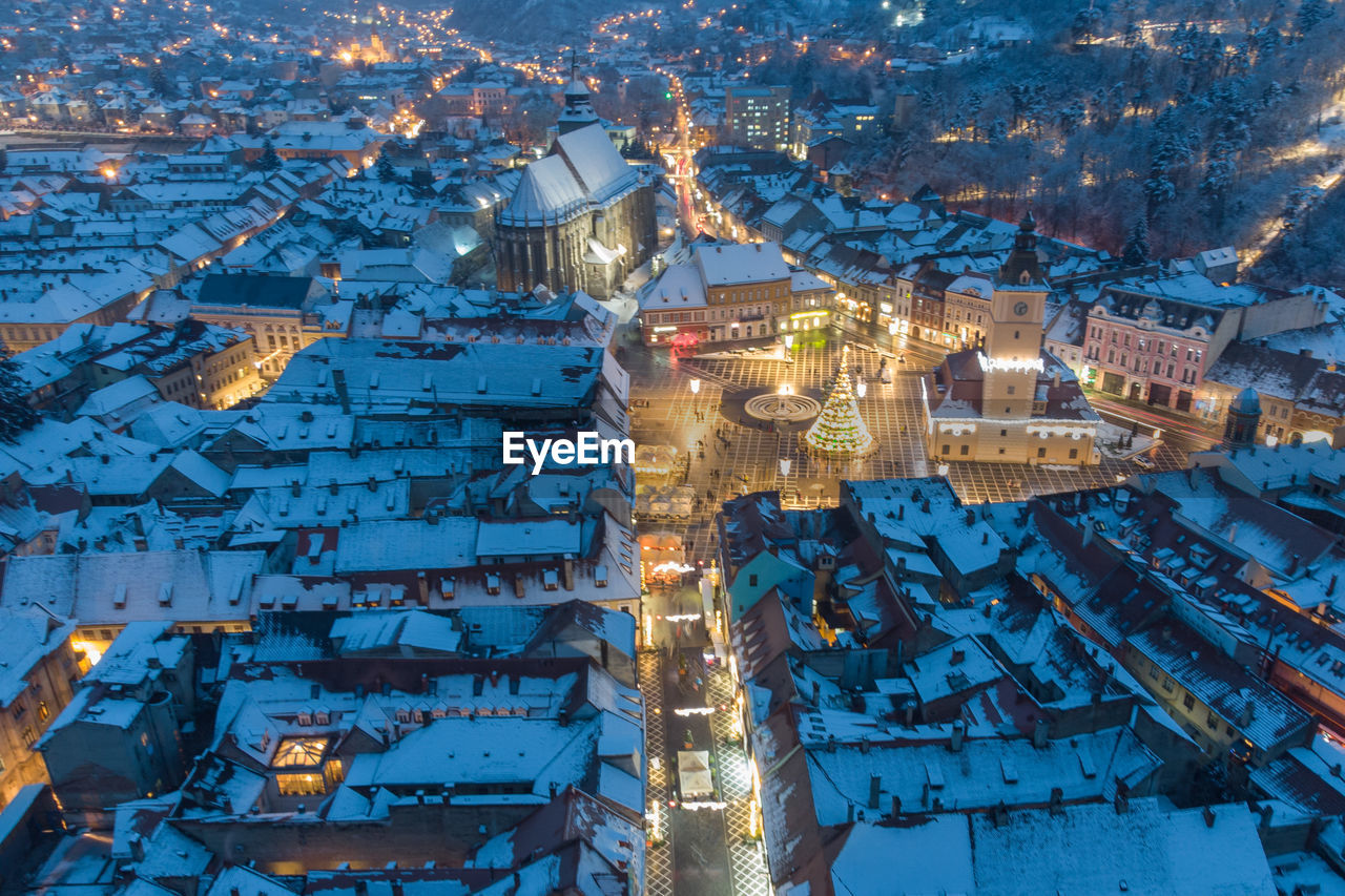 HIGH ANGLE VIEW OF ILLUMINATED BUILDINGS DURING WINTER