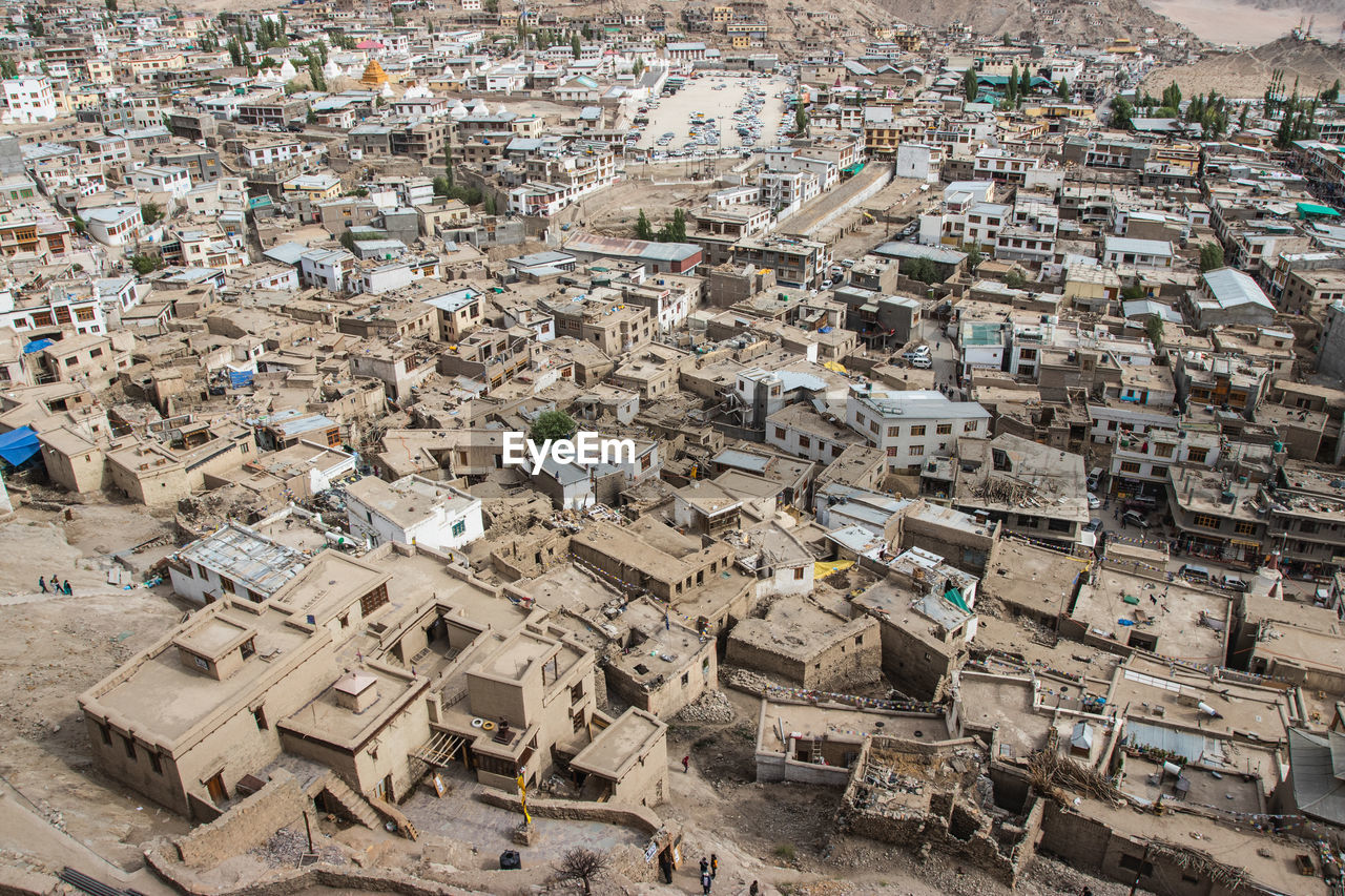 Pattern of houses and residences in leh-ladakh city with blue sky, northern india.