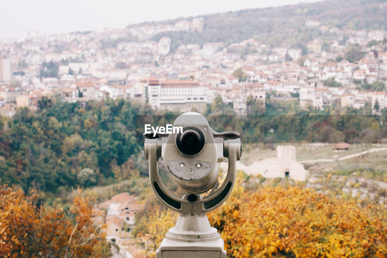 High angle view of binoculars against cityscape