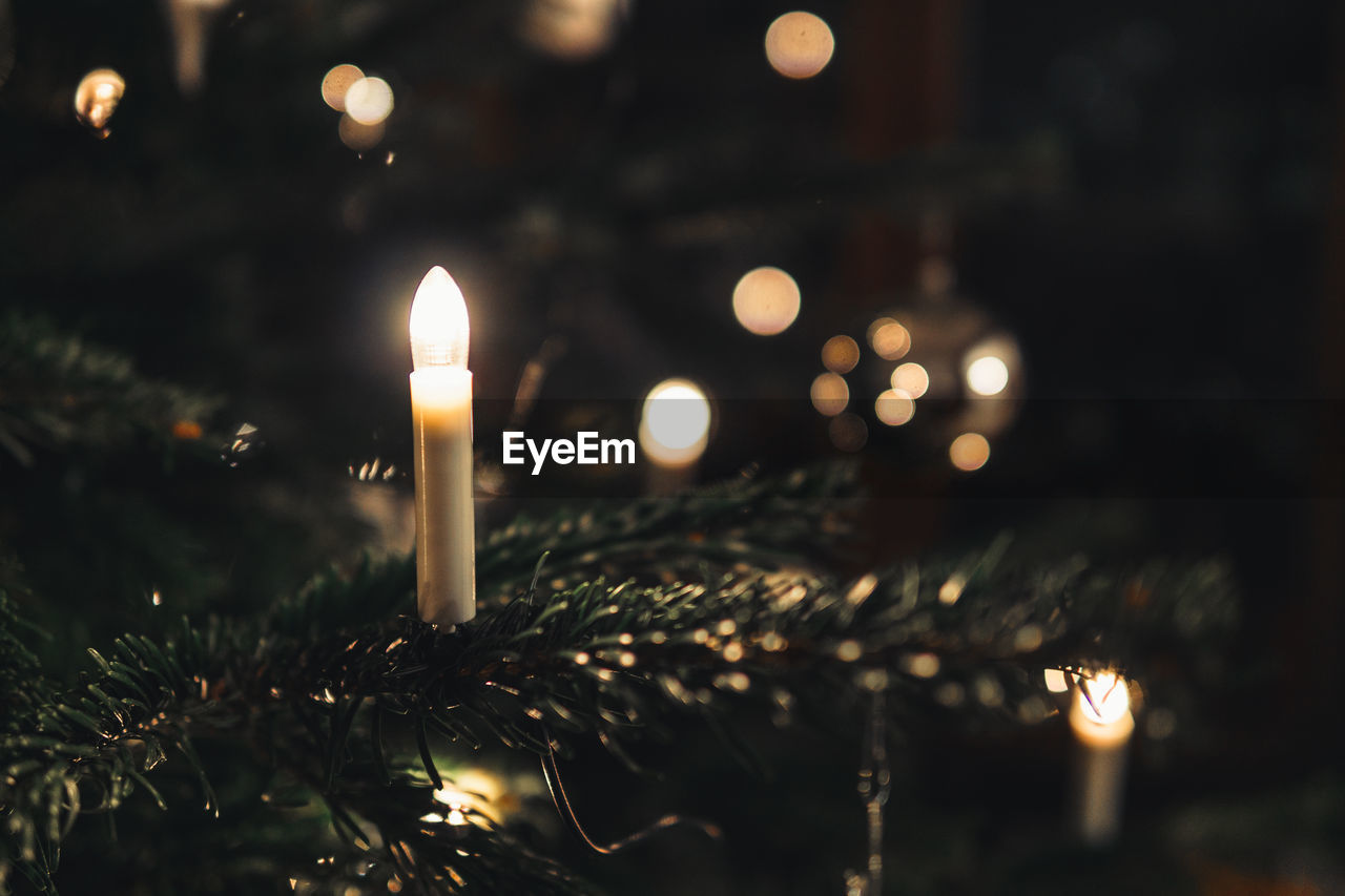 Close-up of illuminated candle