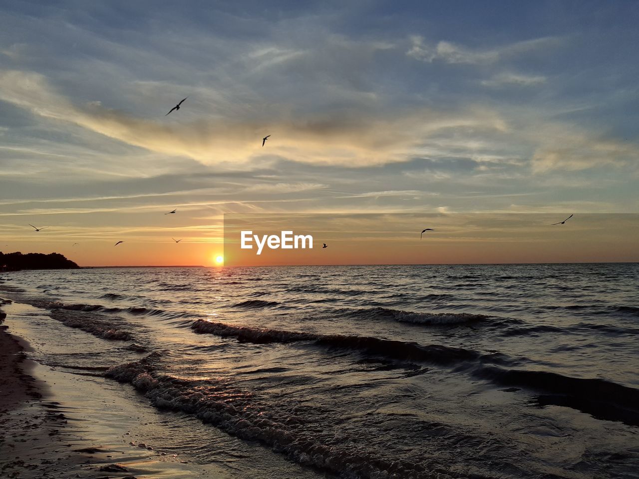 Scenic view of sea against sky during sunset