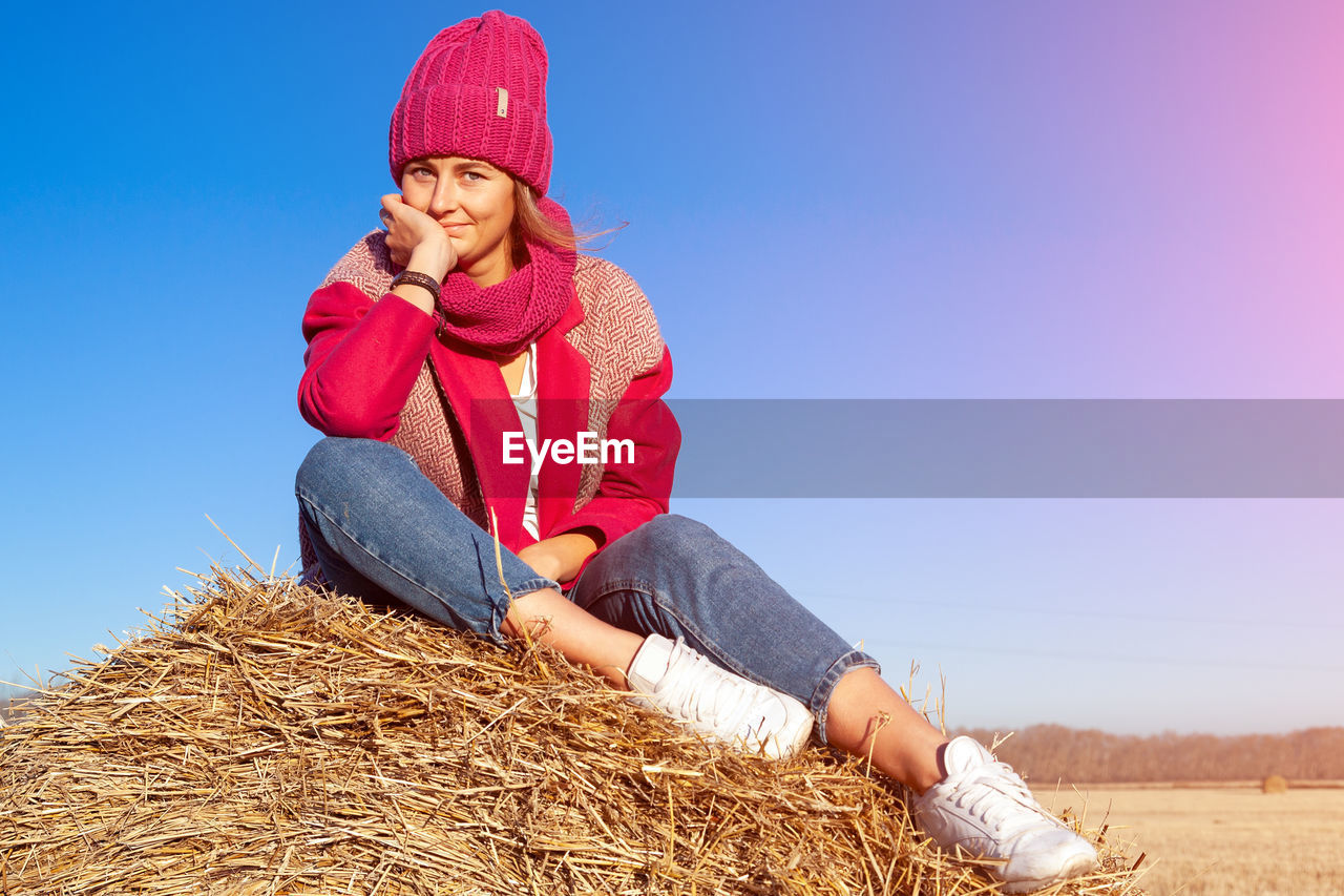 The concept of livestyle outdoor in autumn. close up of a young woman student 