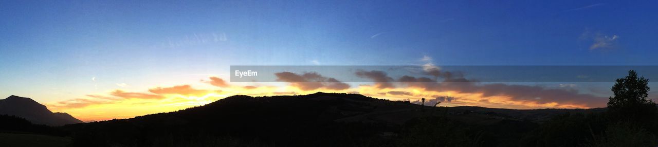 Clouds over rural landscape at dusk