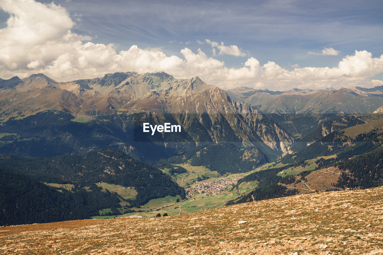 mountain, environment, landscape, scenics - nature, nature, mountain range, sky, beauty in nature, cloud, land, wilderness, travel destinations, travel, valley, tranquility, tranquil scene, no people, tourism, non-urban scene, snow, plateau, outdoors, ridge, pinaceae, day, mountain peak, coniferous tree, idyllic, cold temperature, rock, rural scene, pine tree, winter, mountain pass, social issues, plant, activity, vacation, sunlight, trip, forest, snowcapped mountain, holiday, tree, remote, environmental conservation, extreme terrain
