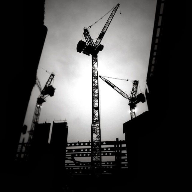 LOW ANGLE VIEW OF CRANE AND CRANE