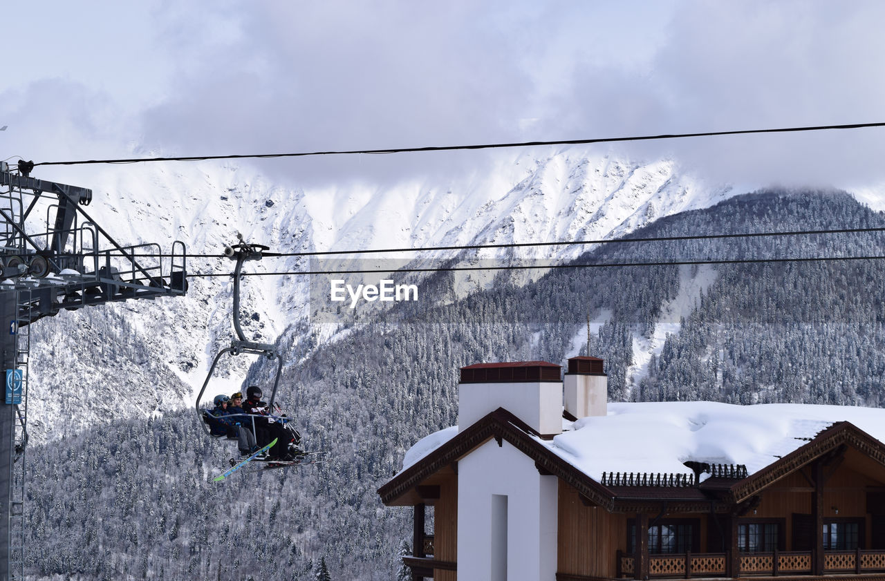 SKI LIFT AGAINST MOUNTAIN