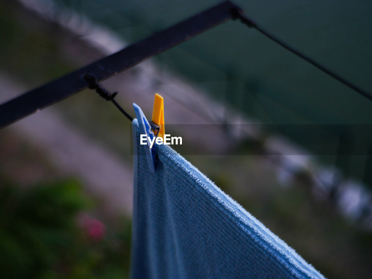Close-up of towel hanging on clothesline
