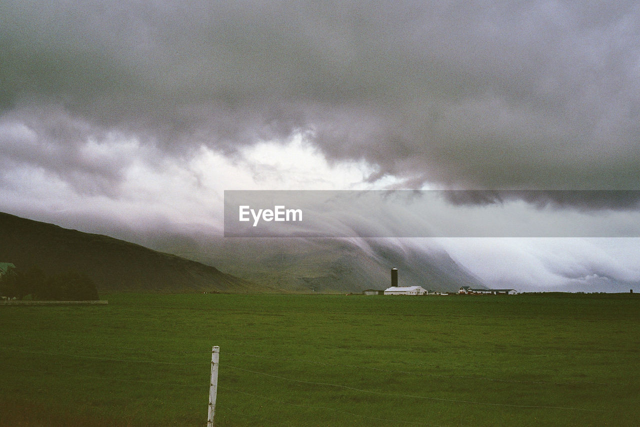 SCENIC VIEW OF LANDSCAPE AGAINST CLOUDY SKY