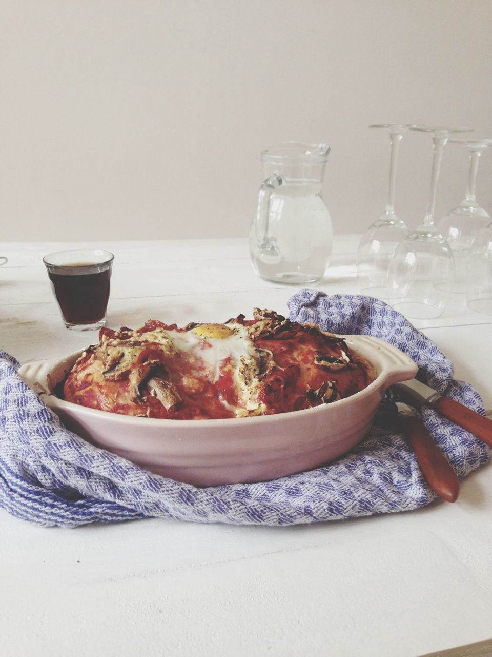 Mushroom gratin with red wine in glass