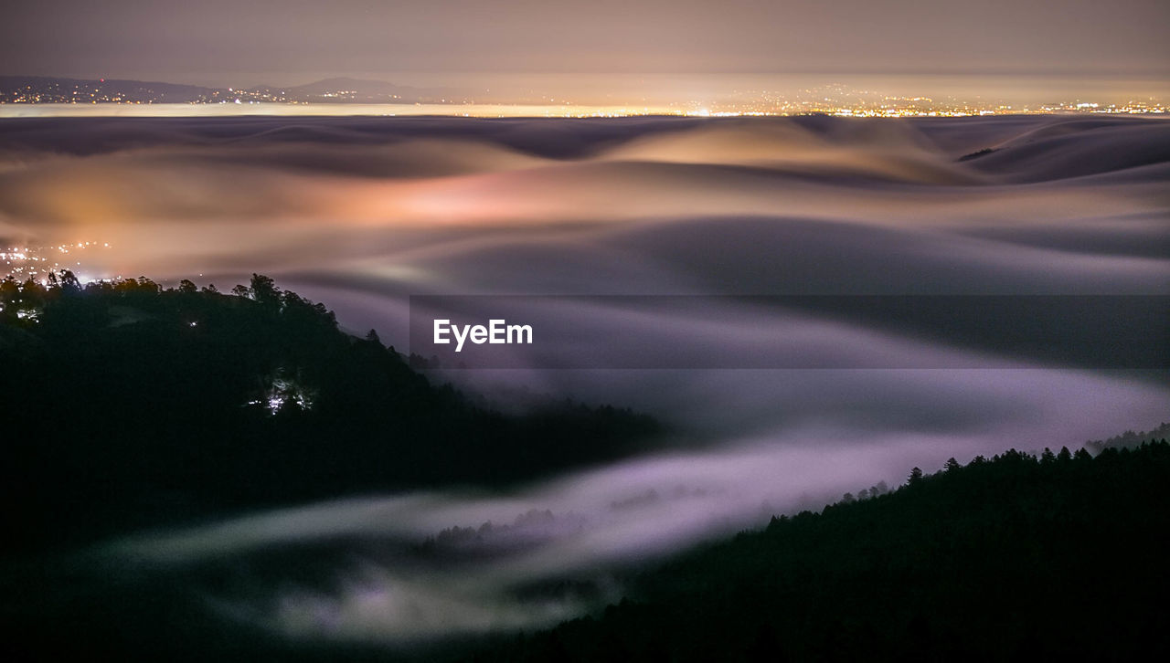 Scenic view of mountains at night