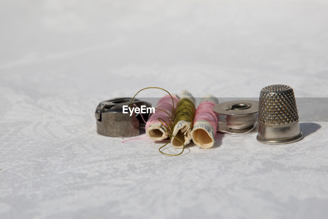 Close-up of sewing items on table