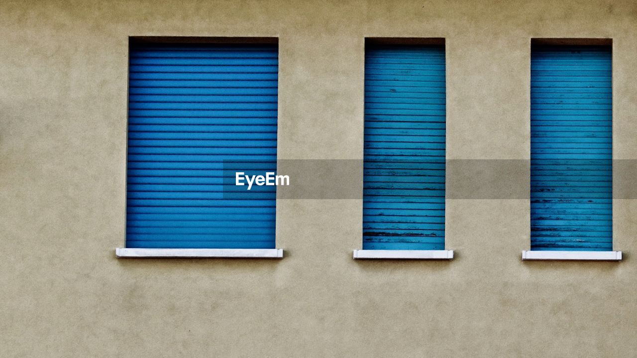 BLUE WINDOW OF BUILDING