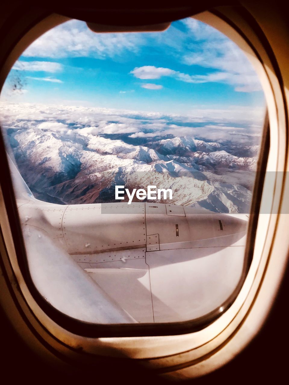 Scenic view of mountains seen through airplane window