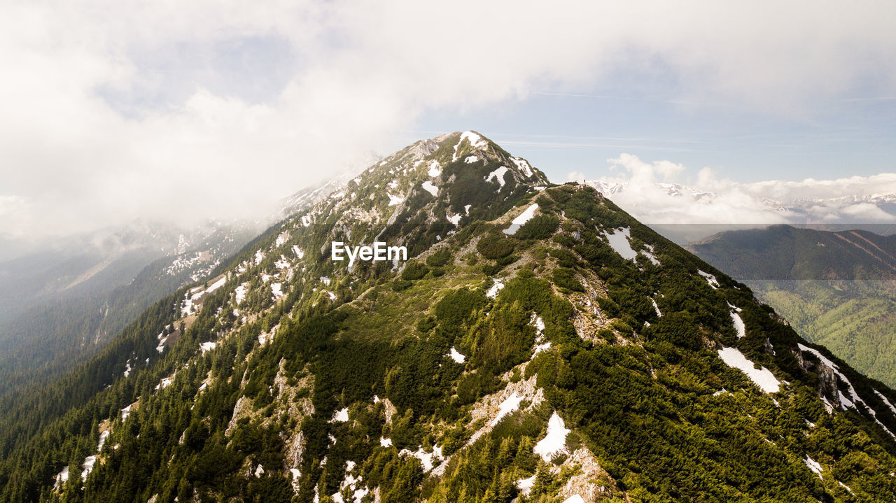 Scenic view of snowcapped mountain against sky