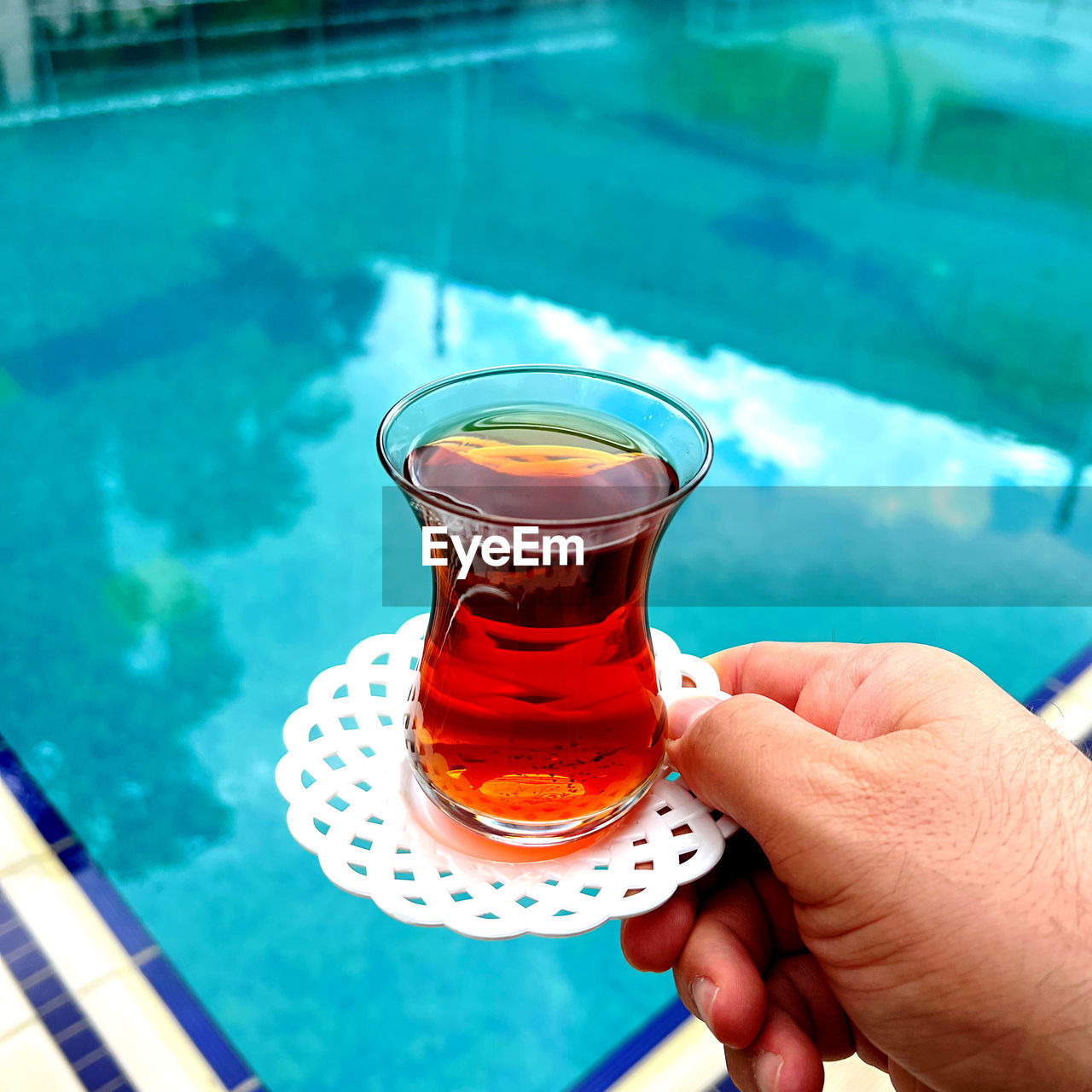 Holding turkish tea drink