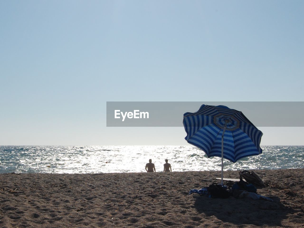 Scenic view of beach against clear sky