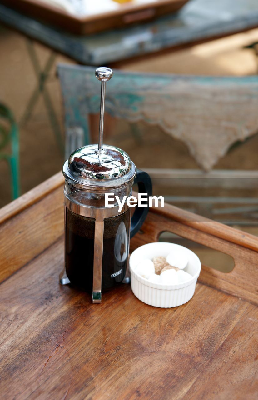 High angle view of black coffee served on table