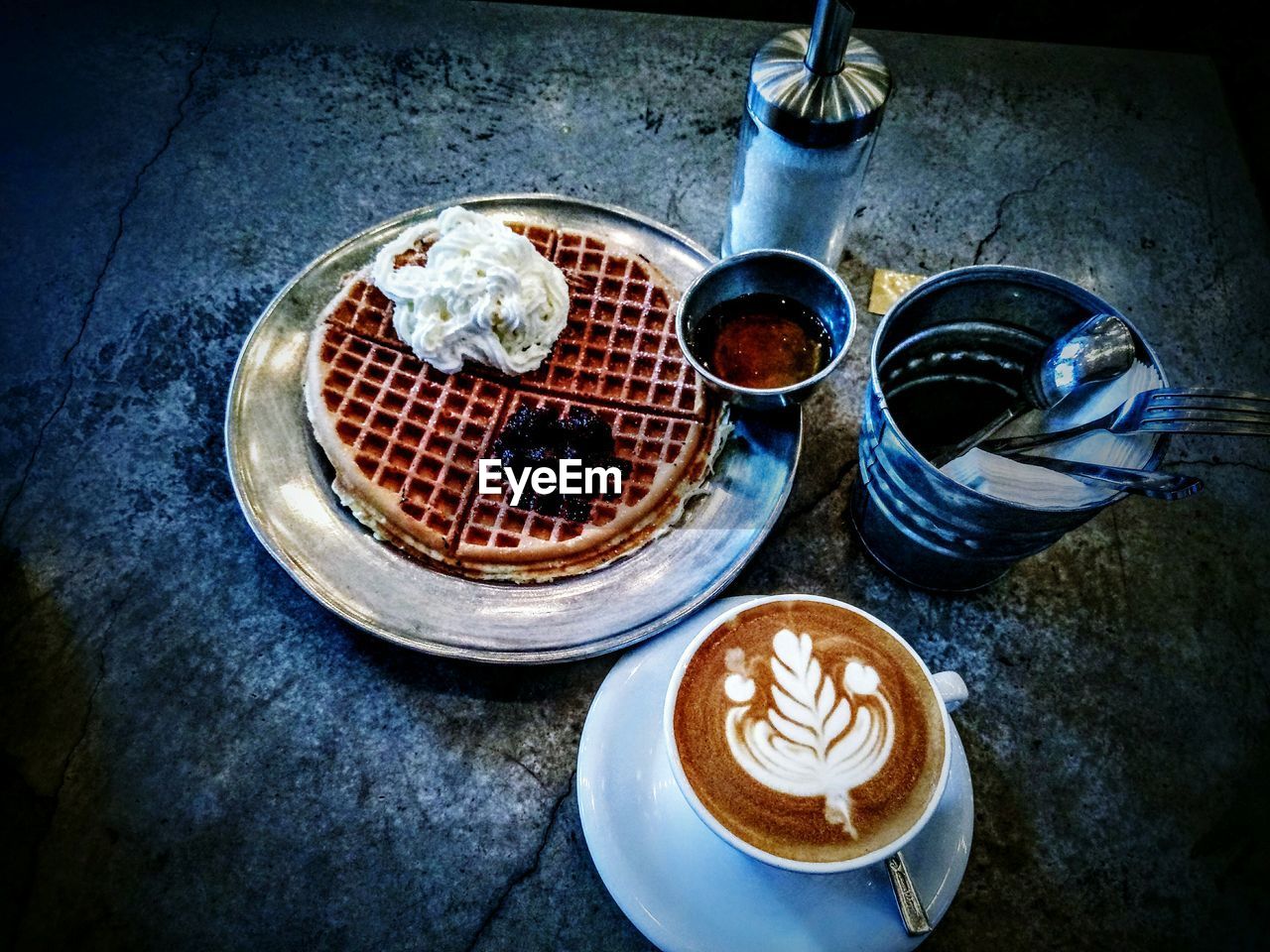 HIGH ANGLE VIEW OF COFFEE ON TABLE AT CAFE