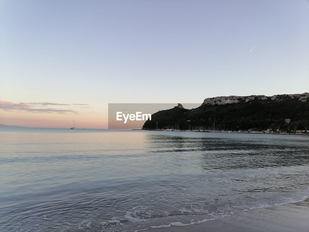 SCENIC VIEW OF BEACH AGAINST CLEAR SKY