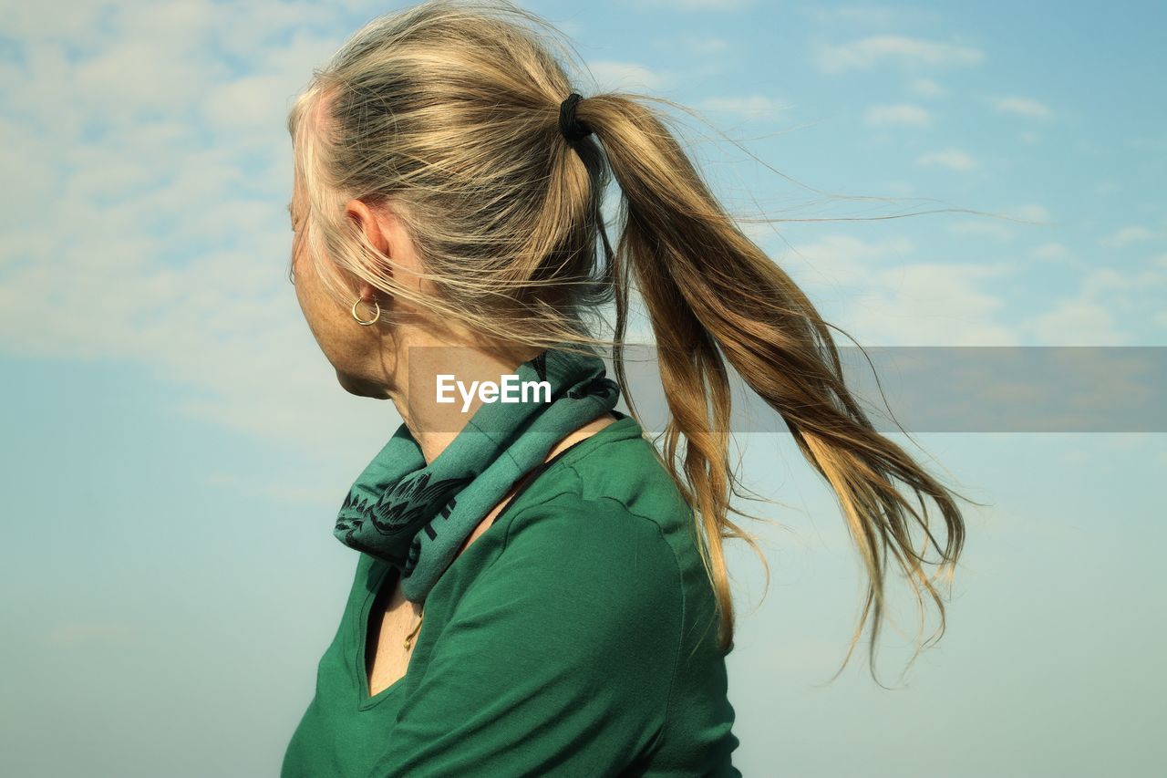 Portrait of woman against sky