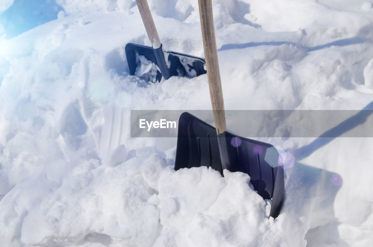 Shovels stuck in snowdrift