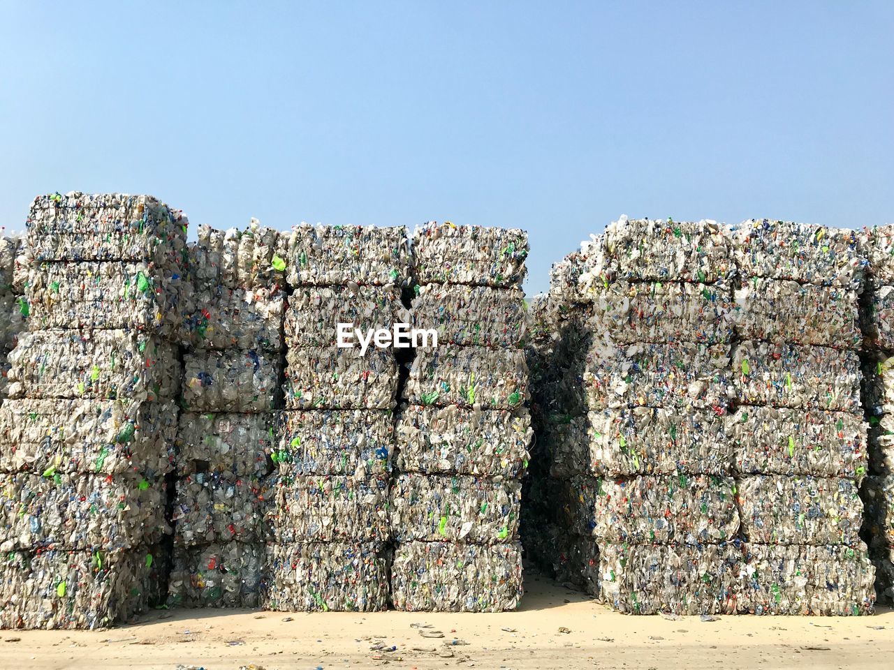 Stack of garbage against clear sky