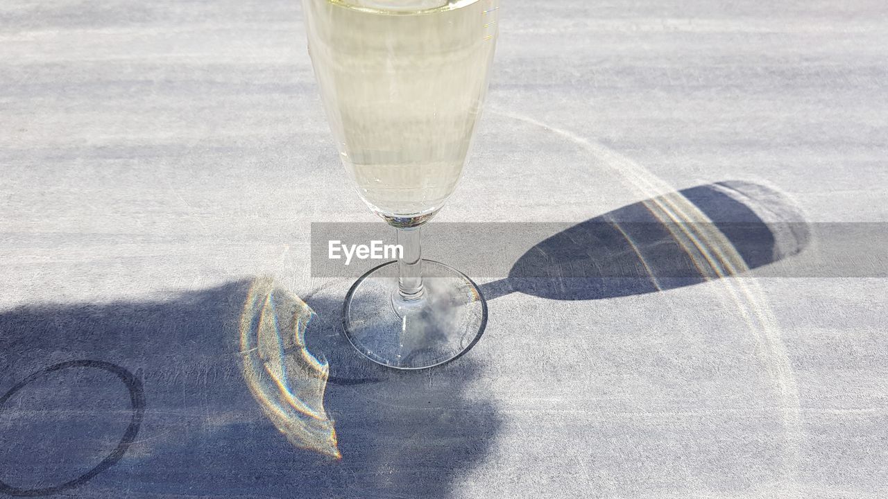 GLASS OF WATER ON TABLE AT DRINKING GLASSES