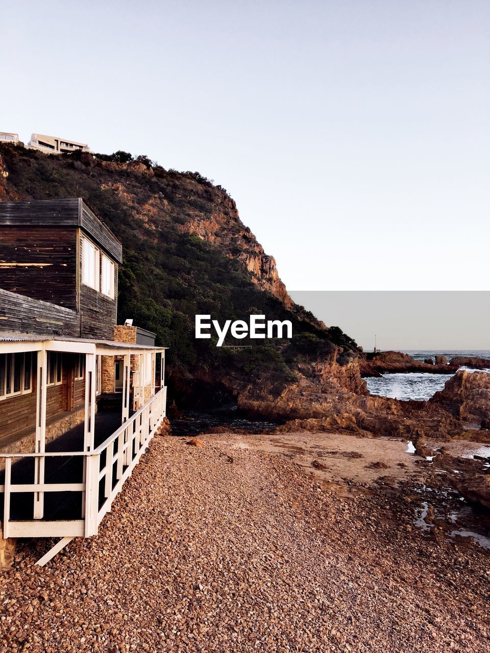 Scenic view of beach against clear sky