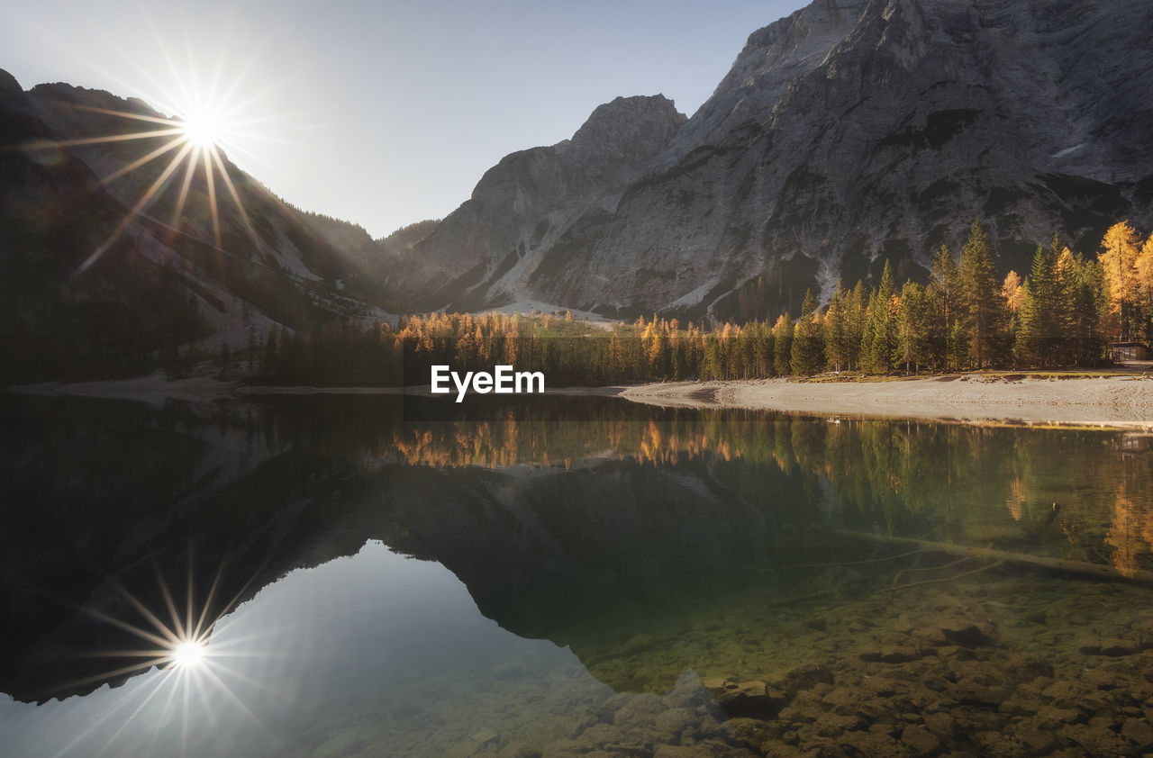 Scenic view of lake and mountains against sky