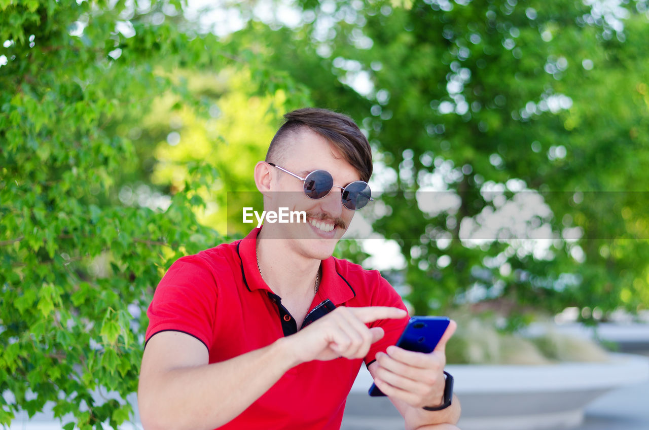 Young man using mobile phone