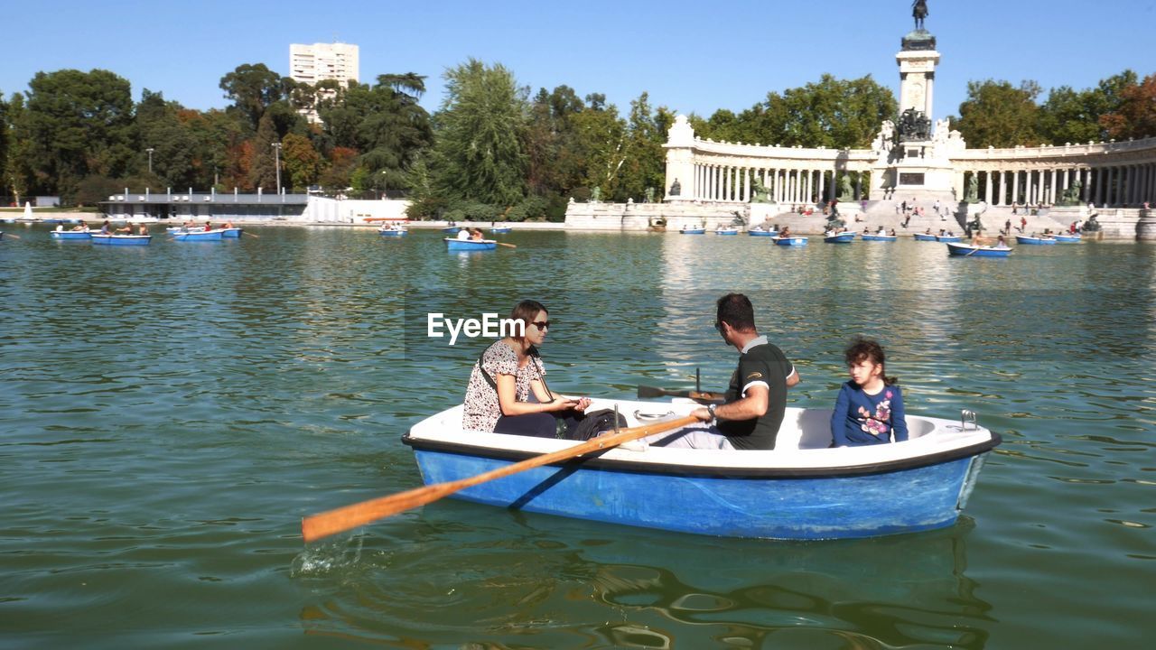 PEOPLE IN BOAT ON LAKE