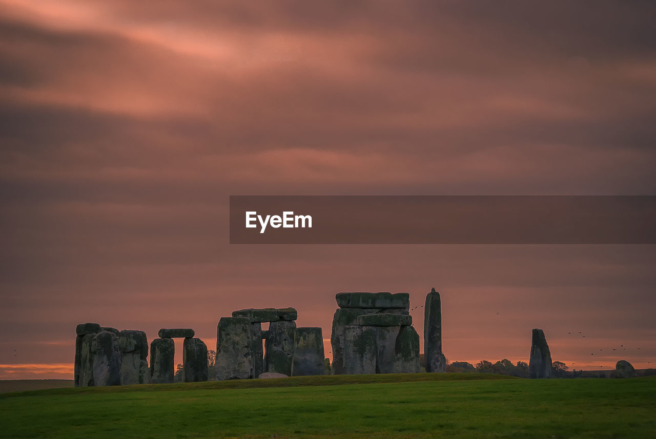 An early morning sky at the ancient circle at stonehenge, wiltshire, uk