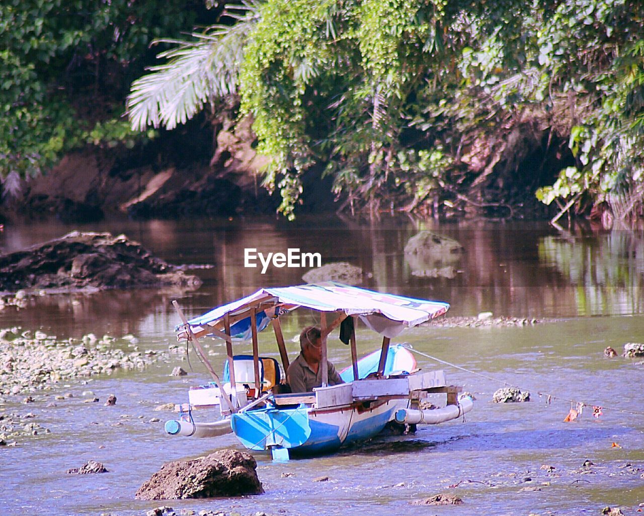 VIEW OF BOATS IN RIVER