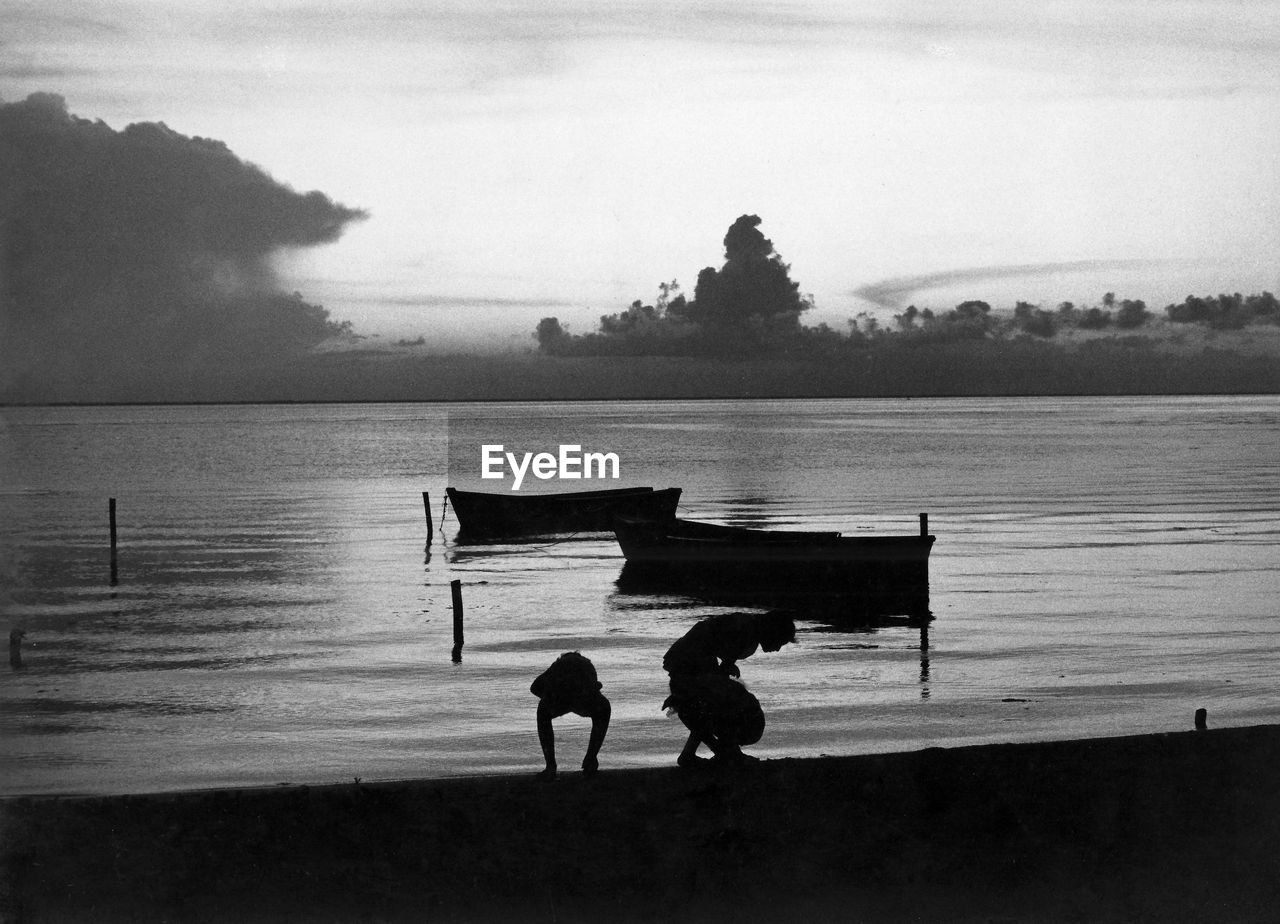 Bay of Mujeres, Isla Mujeres 1981 Bay Of Water Black And White Children Playing On Beach Gelatin Silver Isla Mujeres Mexico Scannedphoto Silhouette Sunset