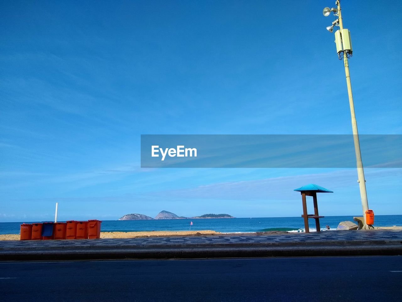 STREET BY SEA AGAINST BLUE SKY