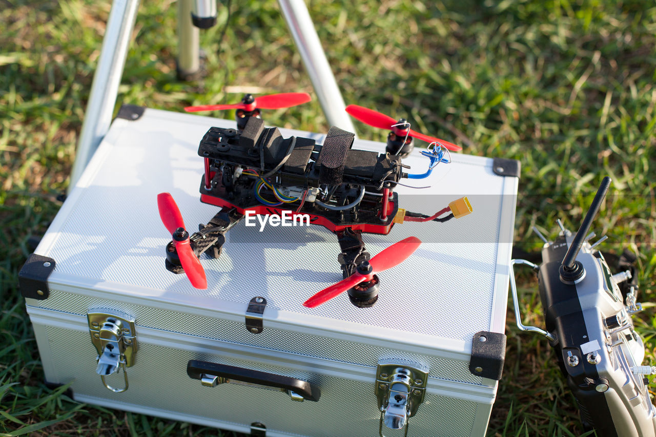 High angle view drone on box over field