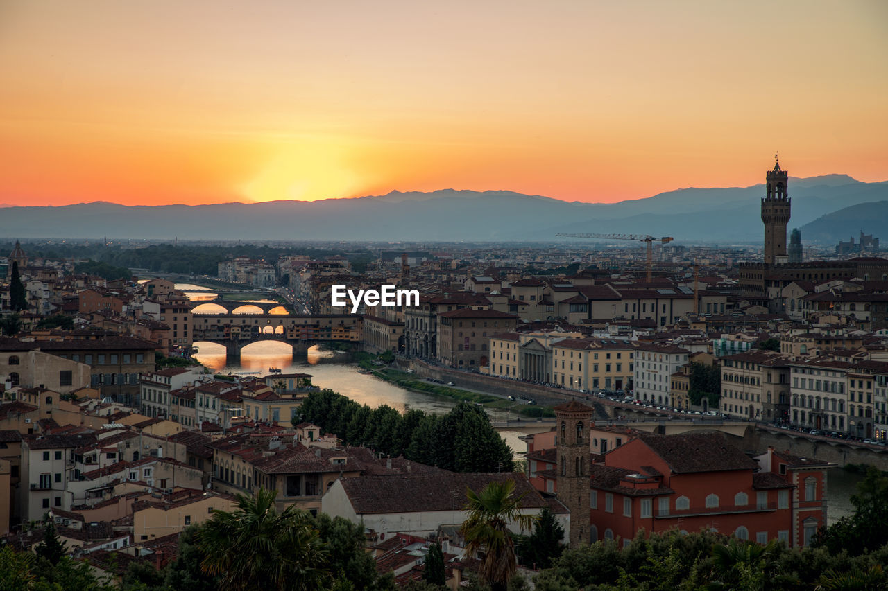 Panoramic view of the city at sunset, view from piazzale michelangelo to river arno, arnolfo tower.