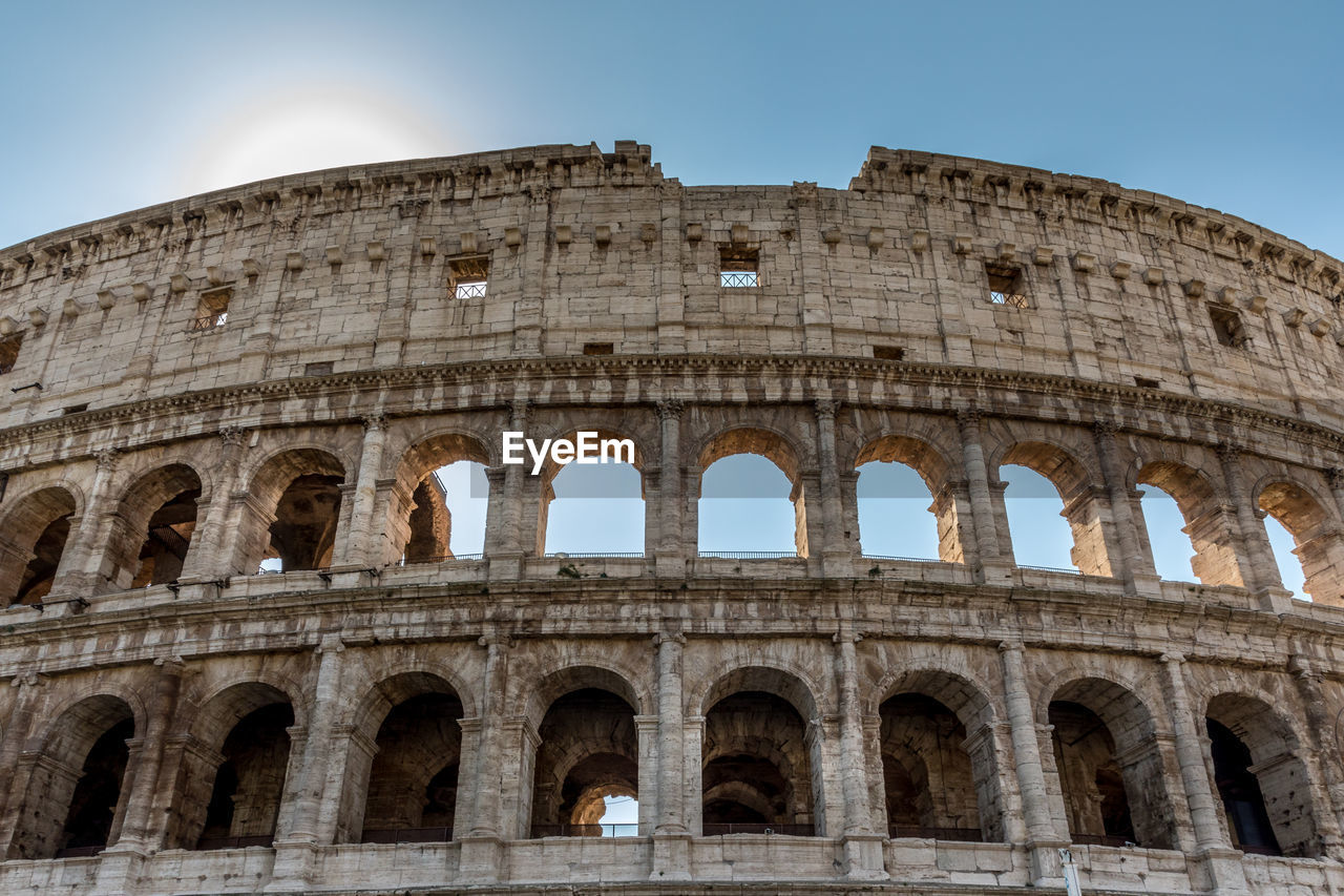 Low angle view of colosseum against clear sky