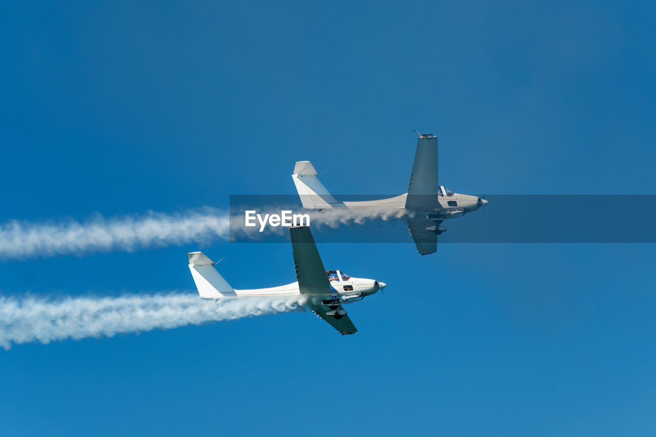 Stunt aerobatic plane performing stunts in air