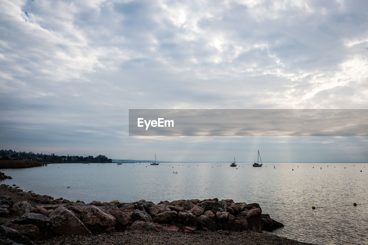 SCENIC VIEW OF ROCKS AGAINST SKY