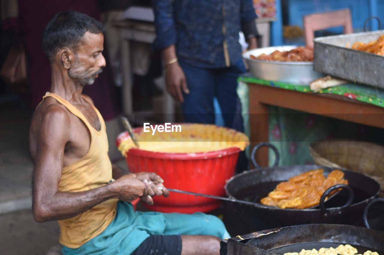 Man preparing food on barbecue grill