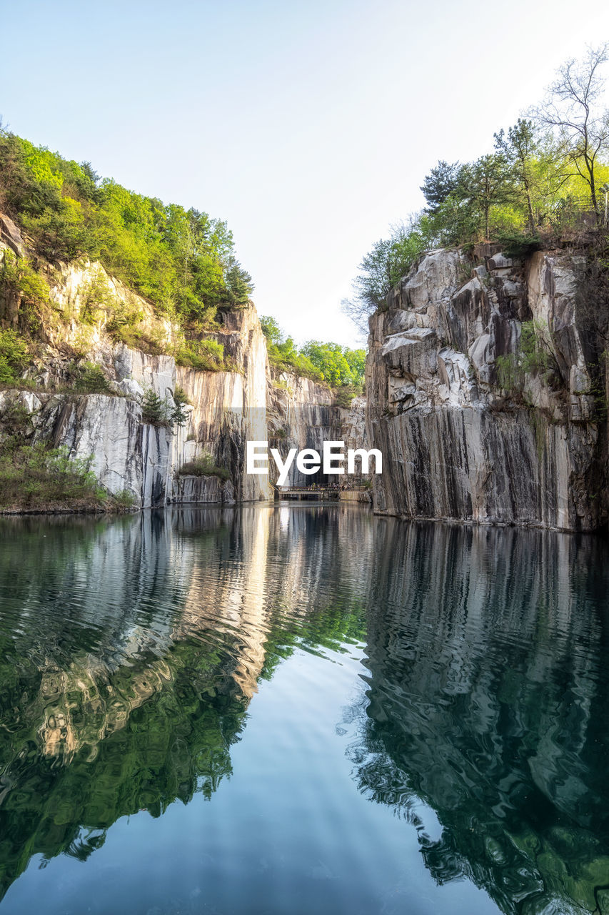 Small lake in pocheon art valley. an old granite quarry turned into park with famous granite cliffs.