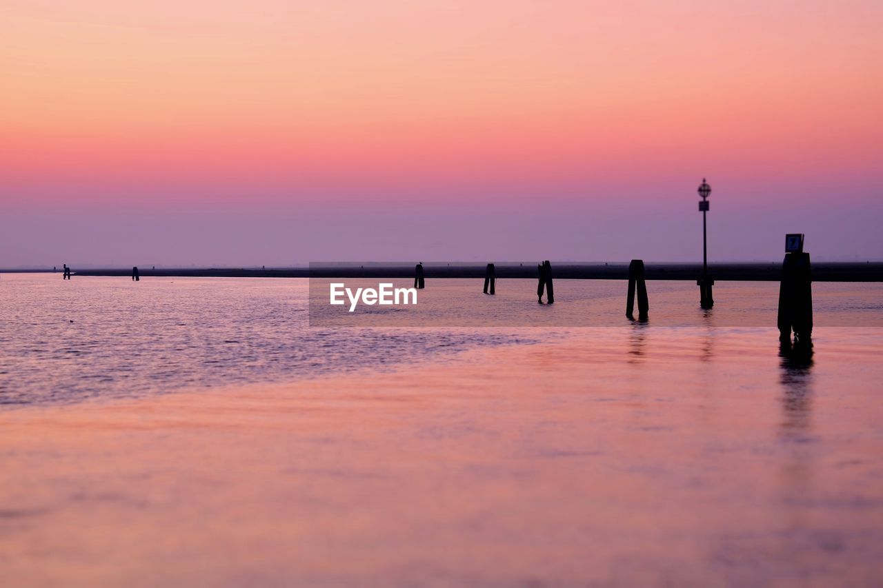 SCENIC VIEW OF SEA DURING SUNSET