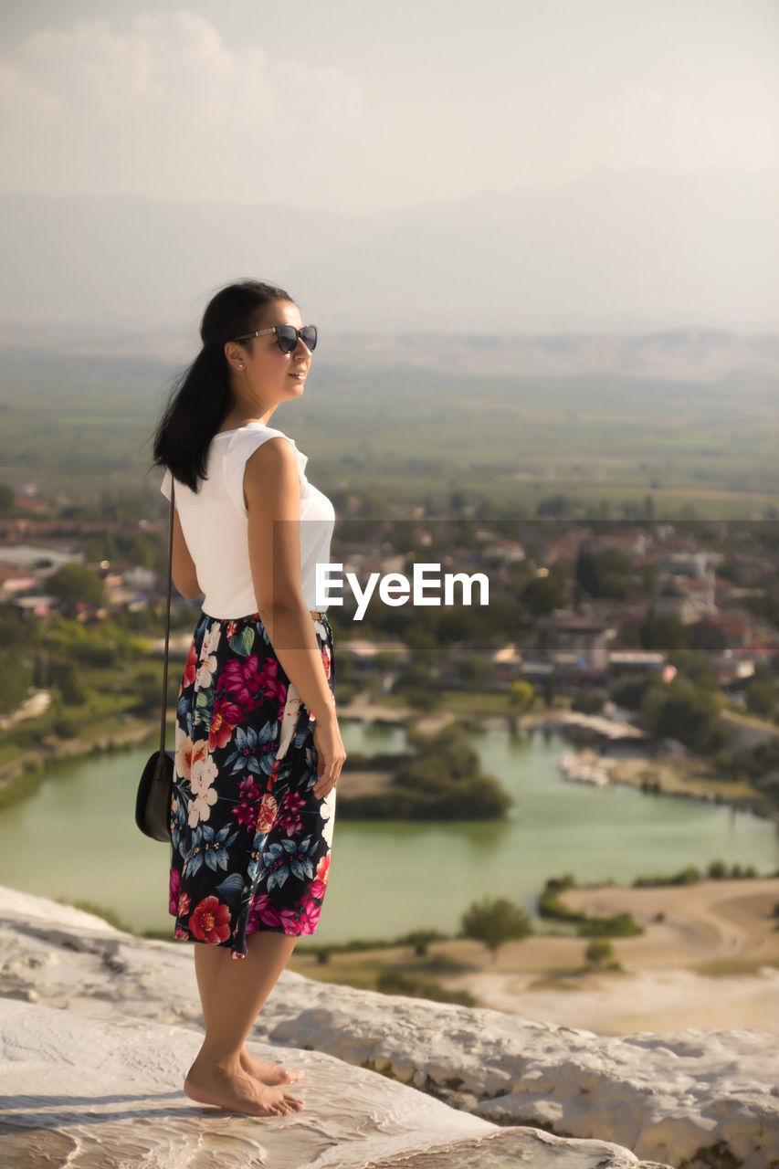 Young woman looking at cityscape